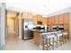 Modern kitchen with stainless steel appliances and breakfast bar at 301 Captiva Dr, Davenport, FL 33896
