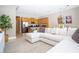 Open living room featuring a spacious sectional sofa and adjacent kitchen at 301 Captiva Dr, Davenport, FL 33896