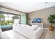 Living room with pool view and large sectional sofa at 301 Captiva Dr, Davenport, FL 33896