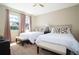Bedroom with two twin-size beds, and a ceiling fan at 301 Captiva Dr, Davenport, FL 33896