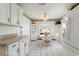 Eat-in kitchen with white cabinets, corner hutch, and a breakfast nook at 114 Ridge View Dr, Davenport, FL 33837