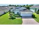 One-story home with landscaped yard and attached garage at 114 Ridge View Dr, Davenport, FL 33837