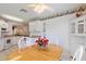 White kitchen with wood dining table and built in hutch at 114 Ridge View Dr, Davenport, FL 33837