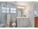 Updated bathroom with white vanity, walk-in shower, and tile flooring at 114 Ridge View Dr, Davenport, FL 33837