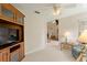 Gathering room with built-in shelving and views into the living room at 114 Ridge View Dr, Davenport, FL 33837