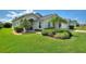 One-story home with manicured lawn and attractive landscaping at 114 Ridge View Dr, Davenport, FL 33837
