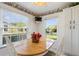Bright breakfast nook with table and chairs, overlooking the backyard at 114 Ridge View Dr, Davenport, FL 33837