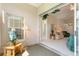 Sunroom with sliding glass doors leading to the backyard and access to the living room at 114 Ridge View Dr, Davenport, FL 33837