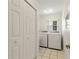 Laundry room with washer, dryer, and ample storage at 114 Ridge View Dr, Davenport, FL 33837
