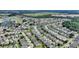 Aerial view of a house and surrounding community with golf course visible at 114 Ridge View Dr, Davenport, FL 33837