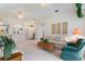 Bright living room featuring a comfy sofa and neutral color palette at 114 Ridge View Dr, Davenport, FL 33837