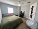 Large bedroom with a ceiling fan and plenty of space for storage at 7132 Five Oaks Dr, Saint Cloud, FL 34773