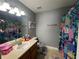 Bathroom with a shower/tub combo, and updated vanity with a modern feel at 7132 Five Oaks Dr, Saint Cloud, FL 34773