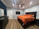 Spacious main bedroom with king-size bed and mounted TV at 7132 Five Oaks Dr, Saint Cloud, FL 34773