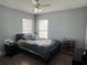 Bedroom with a ceiling fan and large windows that let in lots of light at 7132 Five Oaks Dr, Saint Cloud, FL 34773