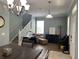Elegant dining room offering seating for multiple guests and a view of the entryway at 7132 Five Oaks Dr, Saint Cloud, FL 34773