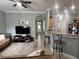 Spacious living room showcasing a comfortable sectional sofa and large TV at 7132 Five Oaks Dr, Saint Cloud, FL 34773