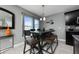 Kitchen dining area with a dark wood table and leather chairs at 340 Elderberry Ct, Kissimmee, FL 34759