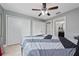 Bedroom with a queen bed and en-suite bathroom at 340 Elderberry Ct, Kissimmee, FL 34759