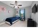 Cozy bedroom with a twin-size bed and a ceiling fan at 340 Elderberry Ct, Kissimmee, FL 34759