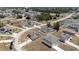 Aerial view of a residential neighborhood with houses featuring solar panels at 340 Elderberry Ct, Kissimmee, FL 34759