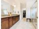 Elegant bathroom with double vanity, large shower, and walk-in closet at 2516 Pickett Ave, Saint Cloud, FL 34772