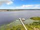 Peaceful lakefront view with a private dock at 2516 Pickett Ave, Saint Cloud, FL 34772