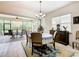 Bright dining room with table and chairs, access to a screened lanai at 2516 Pickett Ave, Saint Cloud, FL 34772