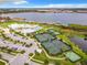 Tennis courts, pool, clubhouse and lake view at 2516 Pickett Ave, Saint Cloud, FL 34772