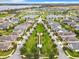 Aerial view of a community with lake, landscaping, and homes at 2516 Pickett Ave, Saint Cloud, FL 34772