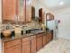 Kitchen with stainless steel appliances and custom cabinetry at 2516 Pickett Ave, Saint Cloud, FL 34772