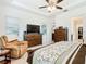 Main bedroom with king bed, dresser, and recliner at 2516 Pickett Ave, Saint Cloud, FL 34772
