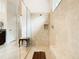 Large walk-in shower with built-in seat and glass enclosure at 2516 Pickett Ave, Saint Cloud, FL 34772