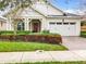 One-story home with red door and white garage at 2516 Pickett Ave, Saint Cloud, FL 34772