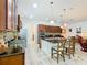 Modern kitchen with dark wood cabinets, granite countertops and stainless steel appliances at 2516 Pickett Ave, Saint Cloud, FL 34772