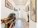 Bright entryway with wood bench and art at 2516 Pickett Ave, Saint Cloud, FL 34772
