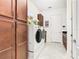 Laundry room with washer, dryer, and ample cabinetry at 2516 Pickett Ave, Saint Cloud, FL 34772