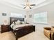 Large main bedroom with king-size bed and sitting area at 2516 Pickett Ave, Saint Cloud, FL 34772