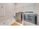 Laundry room with modern washer and dryer, and marble flooring at 2012 Spring Shower Cir, Kissimmee, FL 34744