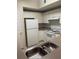 Kitchen with white cabinets, stainless steel sink, and appliances at 239 Longview Ave # 107, Celebration, FL 34747