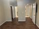 Spacious bedroom with dark brown laminate flooring at 239 Longview Ave # 107, Celebration, FL 34747