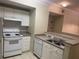 Efficient kitchen with white cabinets, gas range, and dishwasher at 239 Longview Ave # 107, Celebration, FL 34747