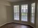 Bright office space with three large windows and dark wood flooring at 239 Longview Ave # 107, Celebration, FL 34747