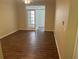 Spacious living room featuring wood-look floors and access to a sunroom at 239 Longview Ave # 107, Celebration, FL 34747