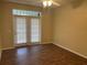 Bedroom with double doors leading to patio/balcony and ceiling fan at 239 Longview Ave # 107, Celebration, FL 34747