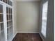 Condo office with two windows, dark wood floors, and french doors at 239 Longview Ave # 107, Celebration, FL 34747