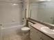 Bathroom with tub, shower, toilet and vanity at 239 Longview Ave # 107, Celebration, FL 34747