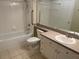 Bathroom with tub, shower, toilet and vanity at 239 Longview Ave # 107, Celebration, FL 34747