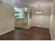Condo dining room with dark wood floors and a chandelier at 239 Longview Ave # 107, Celebration, FL 34747