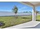 Private backyard with grassy area and patio at 4043 Bannock Ave, Tavares, FL 32778